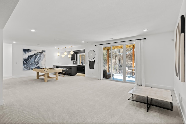 interior space with light carpet, baseboards, and recessed lighting