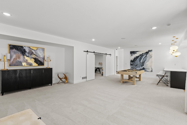 recreation room featuring light carpet, a barn door, baseboards, and recessed lighting