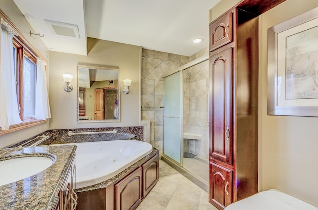 bathroom featuring vanity, a tub with jets, visible vents, tile patterned flooring, and a shower stall