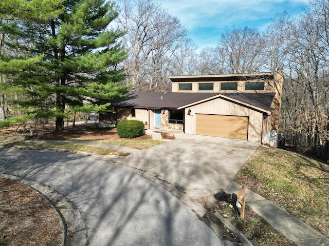 view of front of property featuring an attached garage and driveway