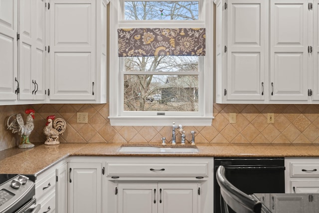 kitchen with white cabinets, dishwasher, and a sink