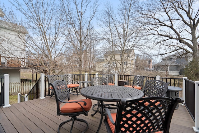 wooden deck featuring outdoor dining area