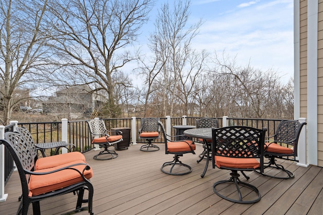 wooden deck with outdoor dining area