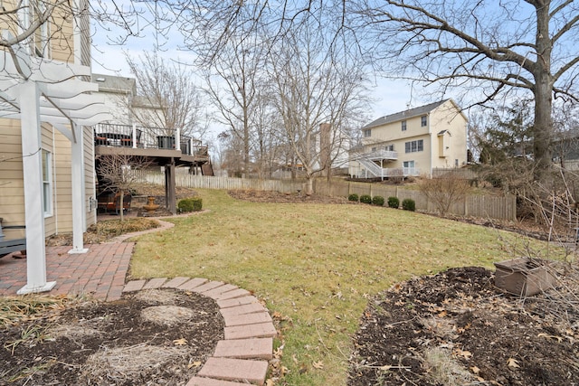 view of yard with fence and a wooden deck