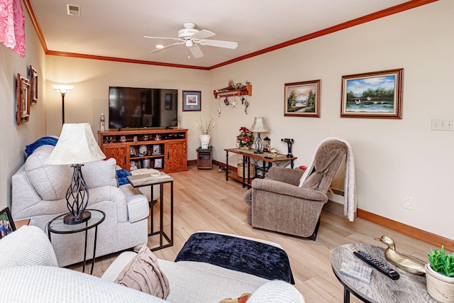 living room with ceiling fan, ornamental molding, and light wood-type flooring