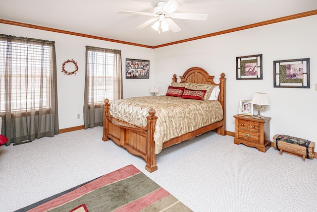 carpeted bedroom with crown molding and ceiling fan