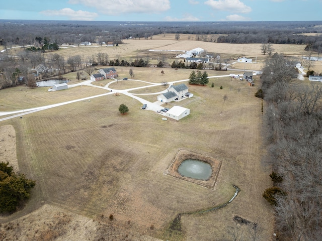 birds eye view of property with a rural view