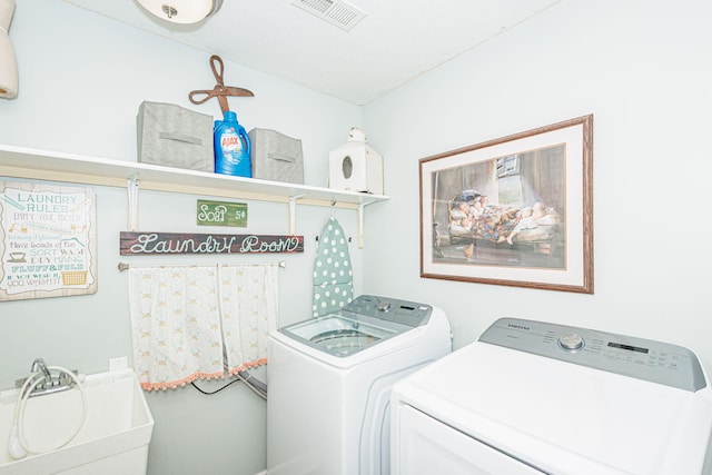 laundry area featuring washer and clothes dryer