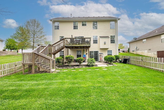 back of property featuring stairway, a deck, and a patio area