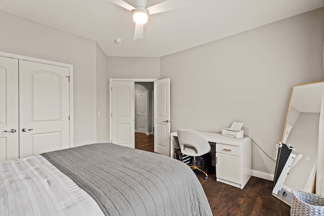 bedroom with dark wood-style floors, baseboards, and a ceiling fan