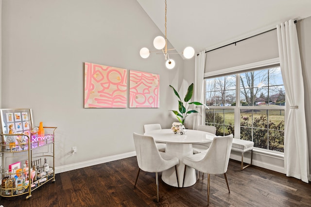 dining room with high vaulted ceiling, dark wood-style flooring, and baseboards