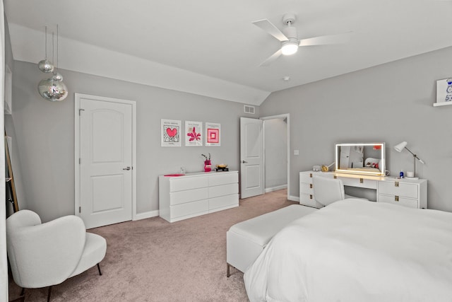 bedroom with lofted ceiling, light colored carpet, visible vents, a ceiling fan, and baseboards