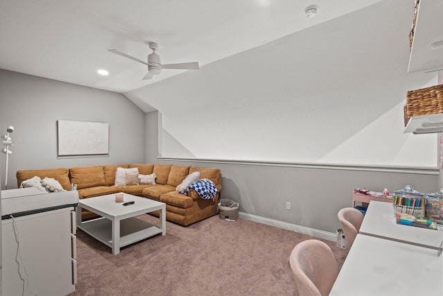 living area featuring baseboards, a ceiling fan, vaulted ceiling, and carpet flooring