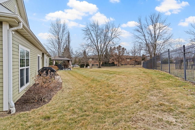 view of yard featuring fence and a gazebo