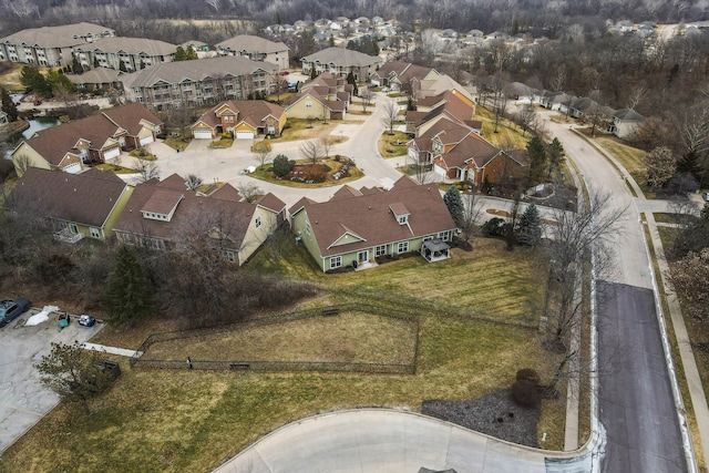 birds eye view of property with a residential view