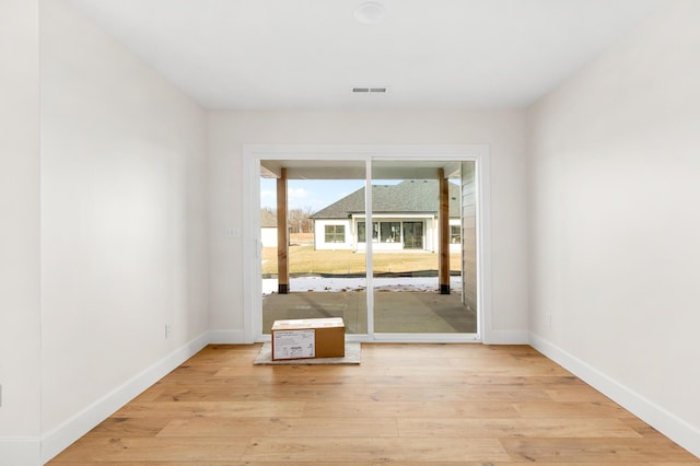 4509 Royal County Rd, Columbia, MO 65201 - spare room featuring baseboards, light wood-style floors, and visible vents