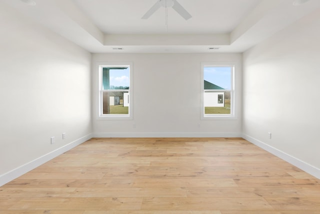 4509 Royal County Rd, Columbia, MO 65201 - spare room featuring light wood finished floors, baseboards, and a raised ceiling