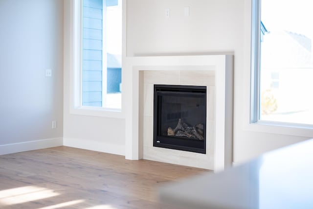 4509 Royal County Rd, Columbia, MO 65201 - interior details featuring baseboards, a fireplace, and wood finished floors