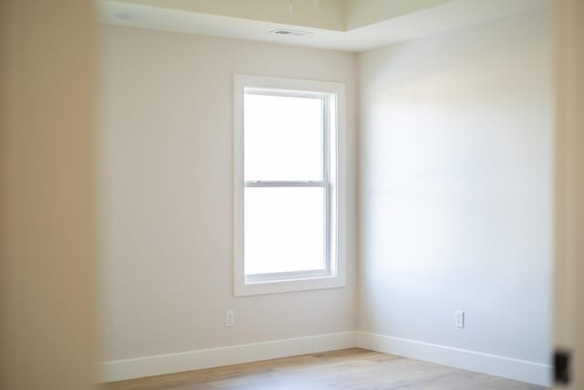 4509 Royal County Rd, Columbia, MO 65201 - empty room with baseboards, visible vents, and light wood-style floors
