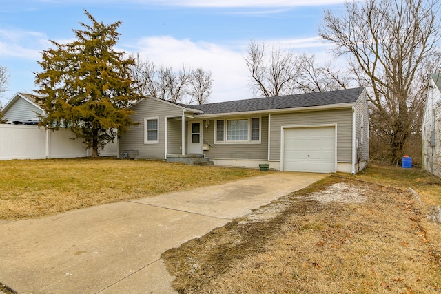 single story home featuring a garage and a front lawn