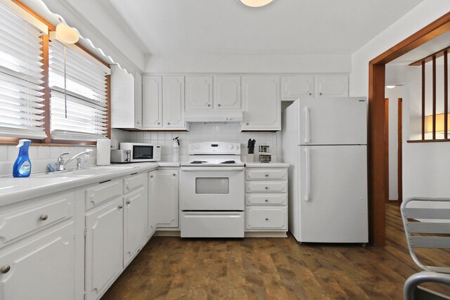2417 Quail Dr, Columbia, MO 65202 - kitchen with tasteful backsplash, white cabinetry, sink, and white appliances