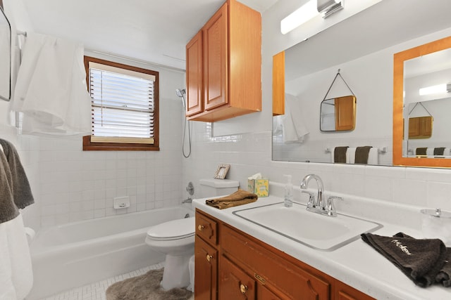 2417 Quail Dr, Columbia, MO 65202 - bathroom with tile walls, vanity, tile patterned floors, and toilet