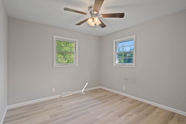 unfurnished room featuring light hardwood / wood-style flooring and ceiling fan