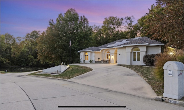 view of front of house featuring solar panels