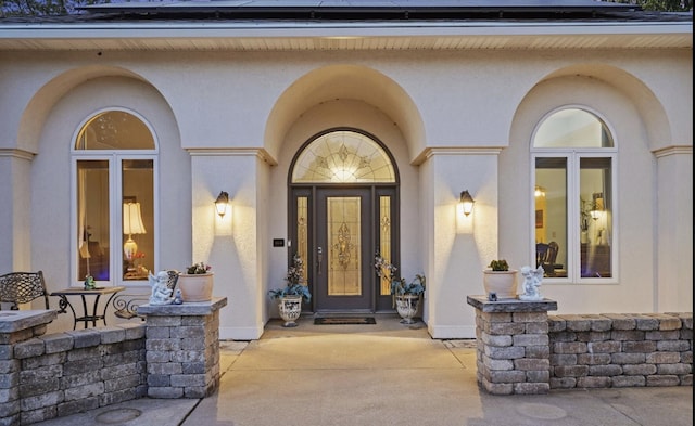 entrance to property featuring solar panels