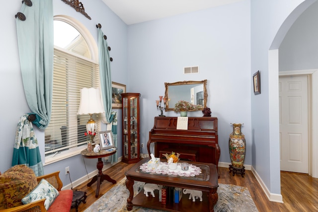 living area with hardwood / wood-style flooring