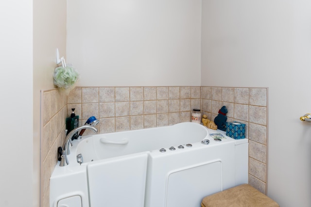 bathroom featuring a tub to relax in