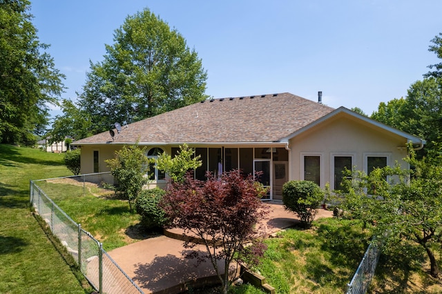 back of house featuring a yard and a patio area