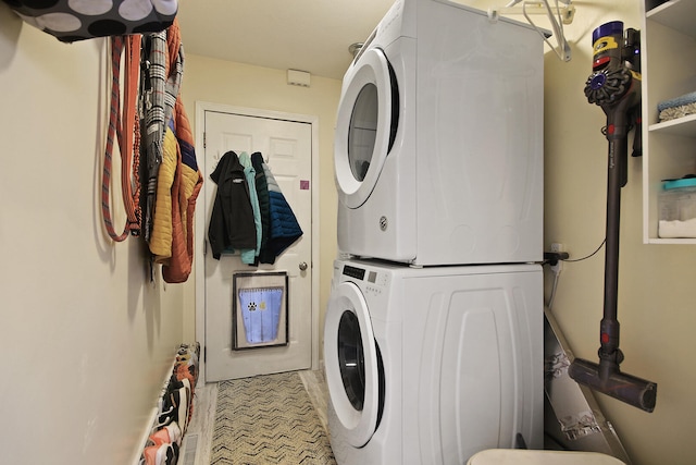 laundry area featuring stacked washer and dryer