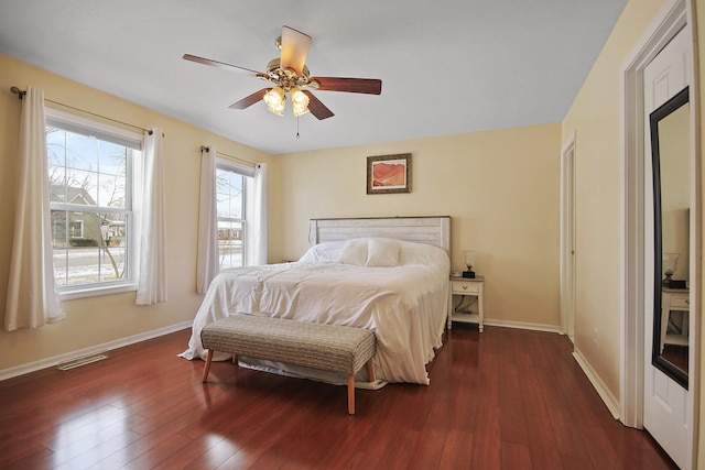 bedroom with dark wood-type flooring and ceiling fan