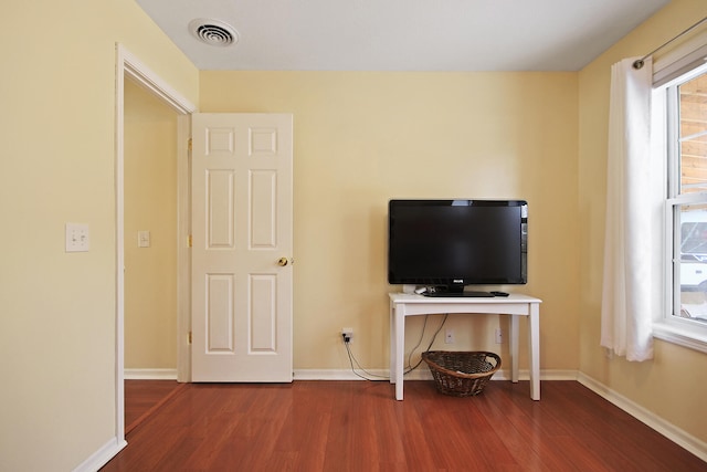 unfurnished living room featuring hardwood / wood-style floors