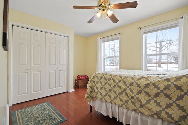 bedroom with hardwood / wood-style flooring, a closet, and ceiling fan