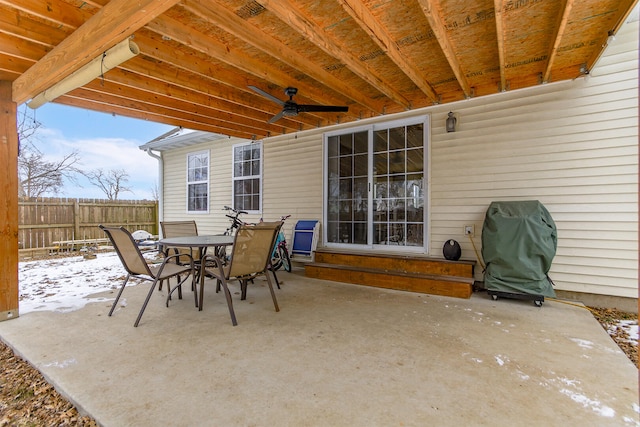 snow covered patio featuring area for grilling