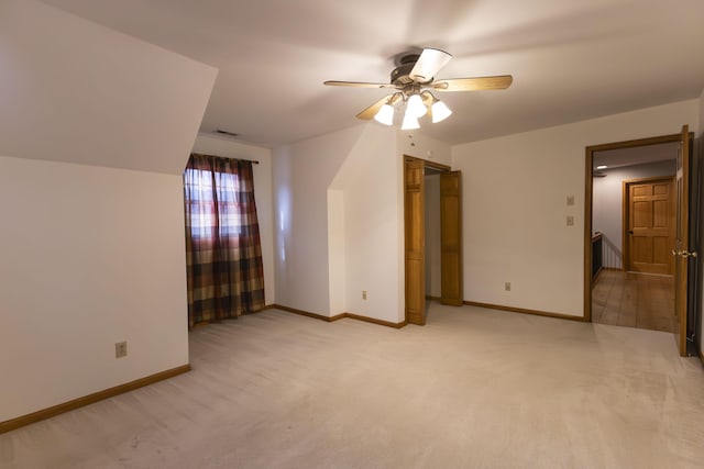 unfurnished bedroom with light carpet and ceiling fan