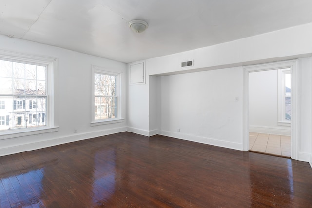 unfurnished room featuring hardwood / wood-style flooring