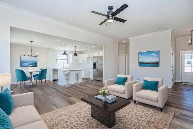 living area featuring baseboards and light wood finished floors