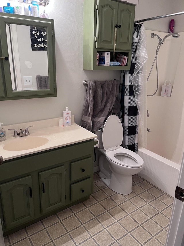 bathroom featuring toilet, shower / bath combo with shower curtain, and vanity