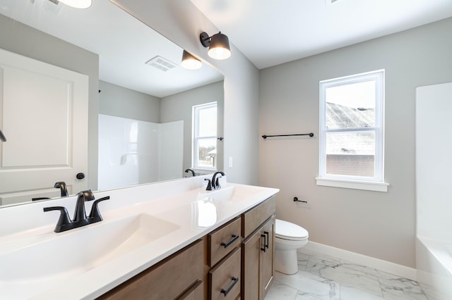 bathroom with vanity and toilet