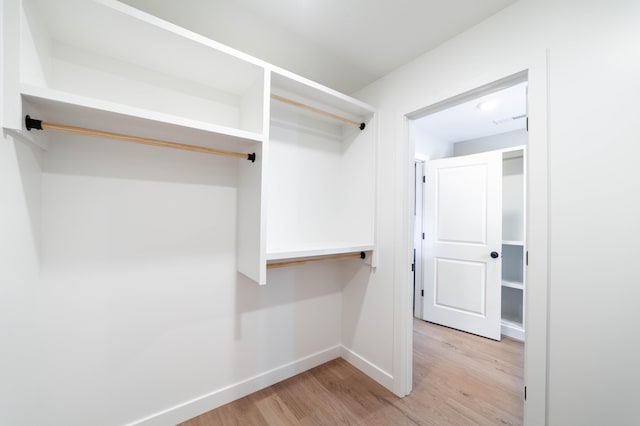 spacious closet featuring light wood-type flooring