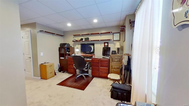 office space featuring a paneled ceiling and light colored carpet