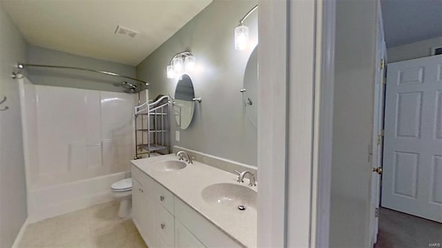 full bathroom featuring vanity, tile patterned flooring, toilet, and  shower combination