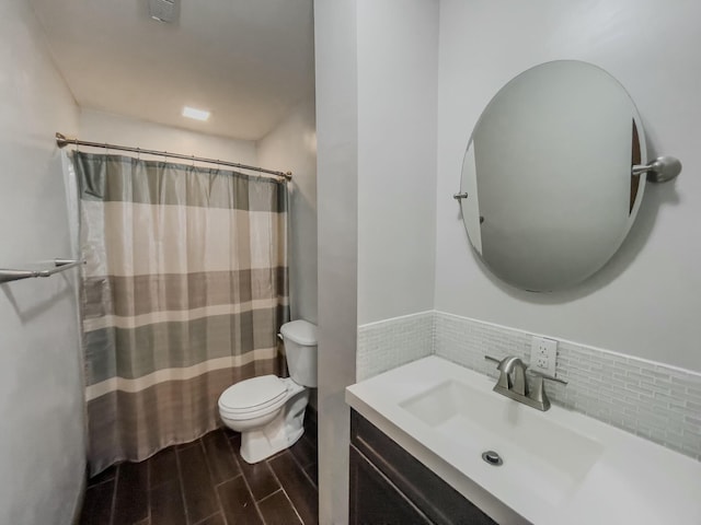 bathroom featuring visible vents, toilet, curtained shower, wood tiled floor, and vanity