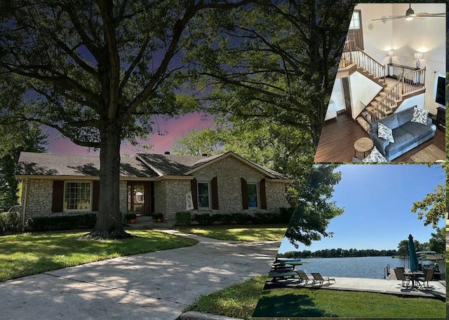 view of front of house featuring a front yard and a water view