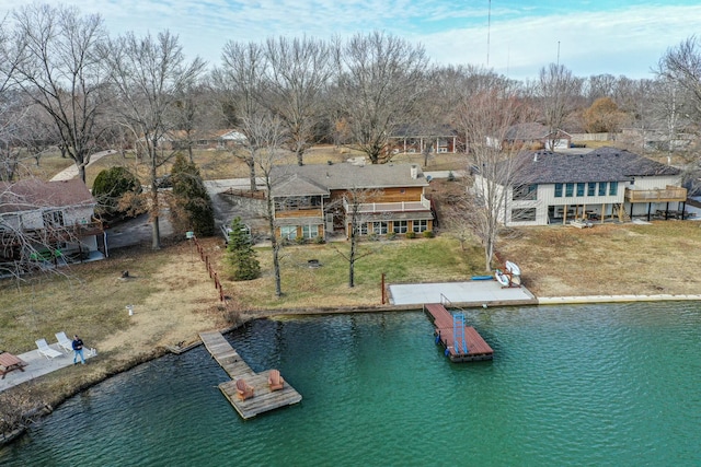 exterior space with a water view and a yard