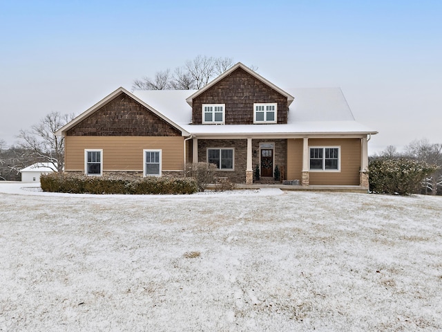 craftsman inspired home featuring stone siding