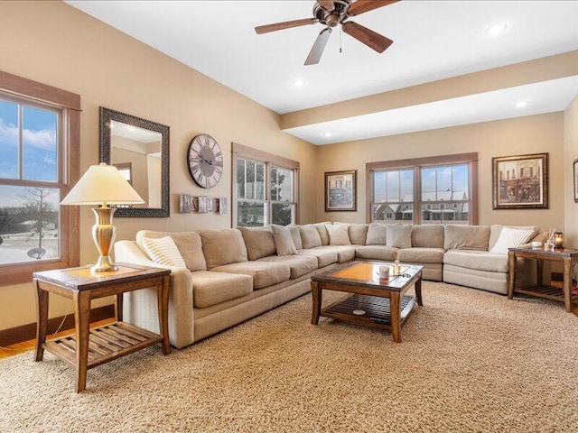 living area with a ceiling fan and recessed lighting